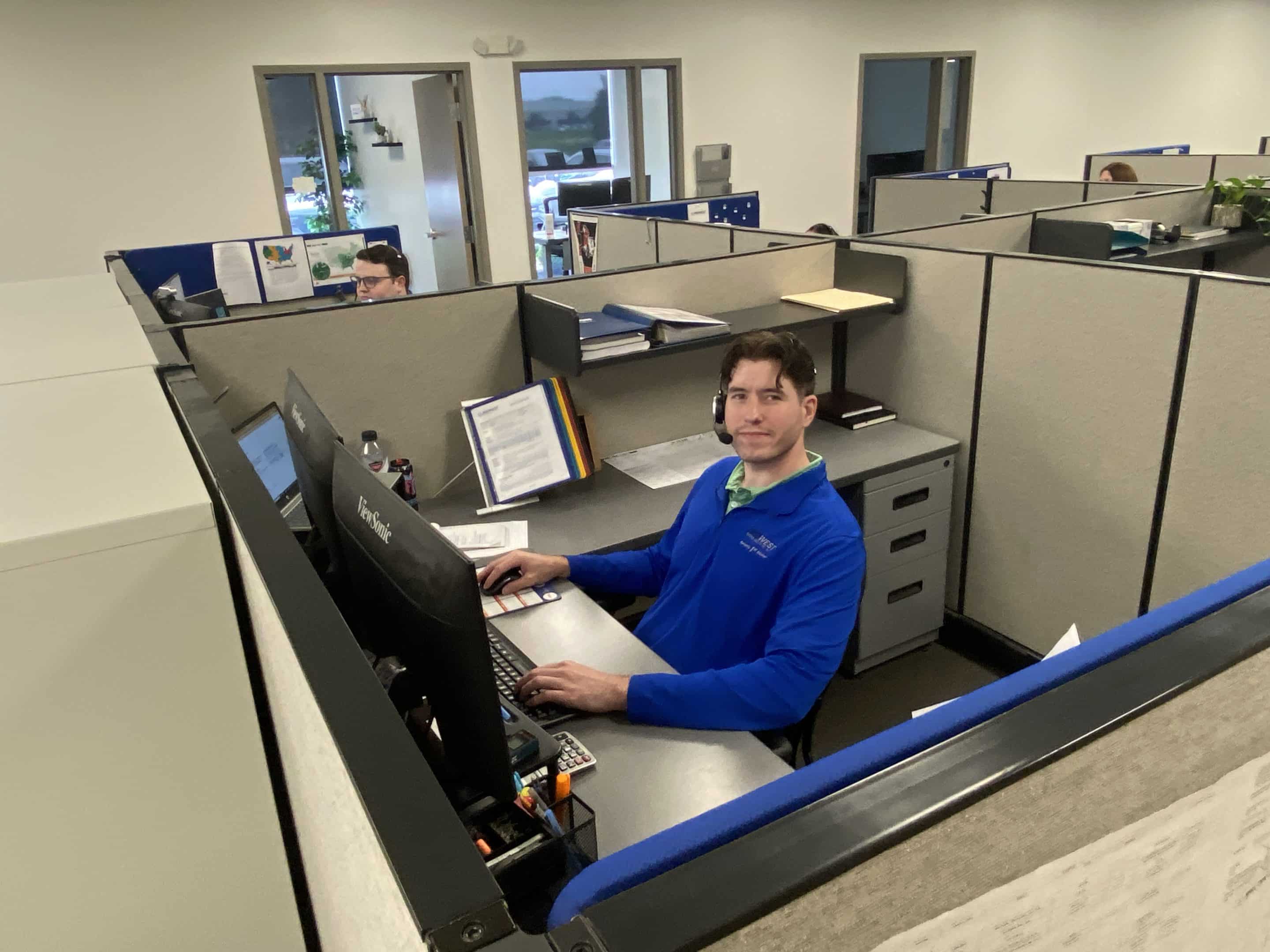 Man working at an office cubicle